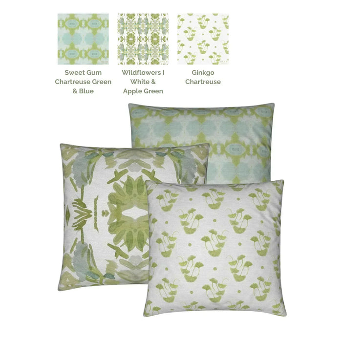 Luxury decorative pillow featuring an abstract small repeat pattern in chartreuse green and soft blue tones, styled for a layered modern traditional interior.